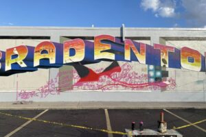 mural in progress painting a giant bird