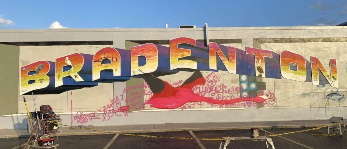 artist painting giant flamingo using a doodle grid method