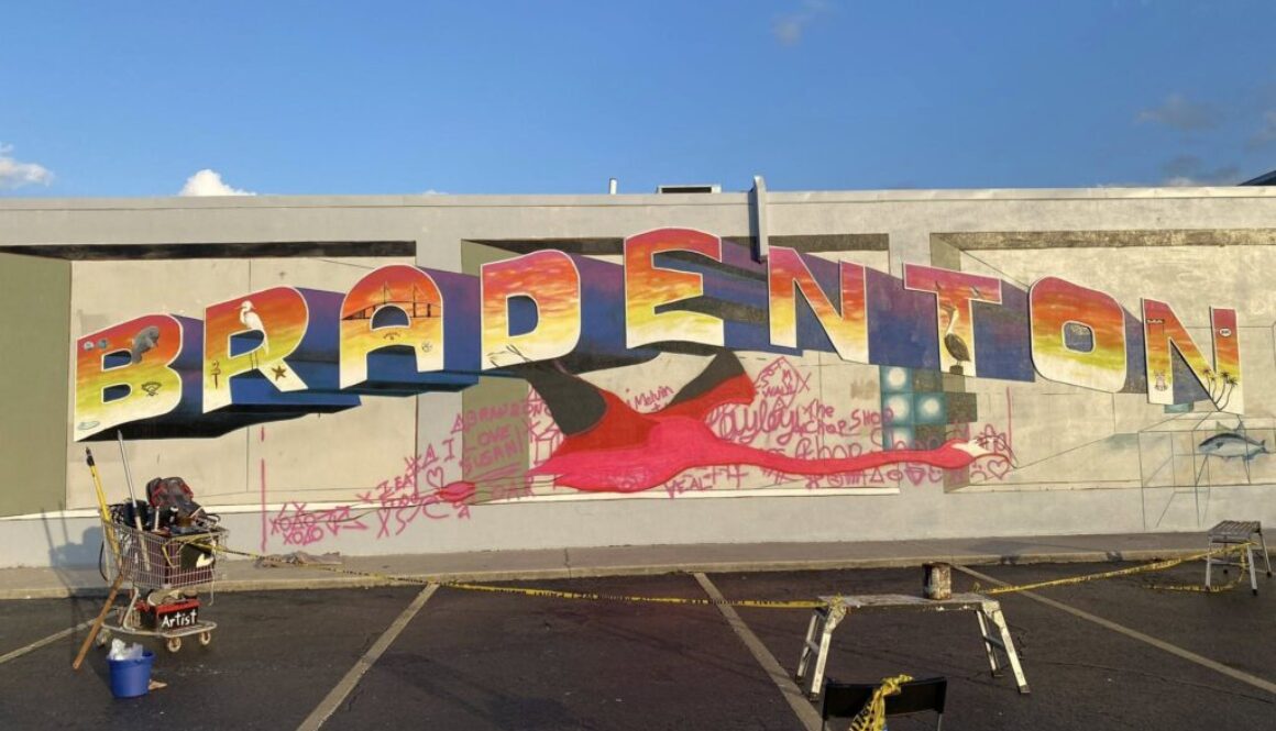 artist painting giant flamingo using a doodle grid method