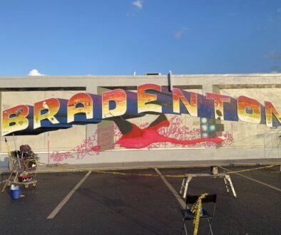 artist painting giant flamingo using a doodle grid method