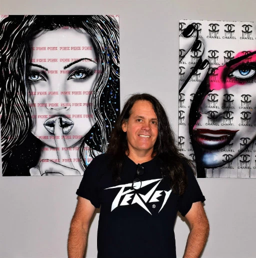 Brandon Scott in front of his art work 